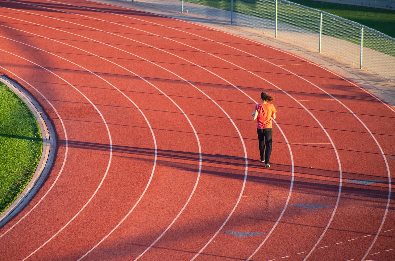 Running, woman, track — How Dr. Andrew Gomes Uses Diffusion Tensor Imaging to Improve Brain Injury Care