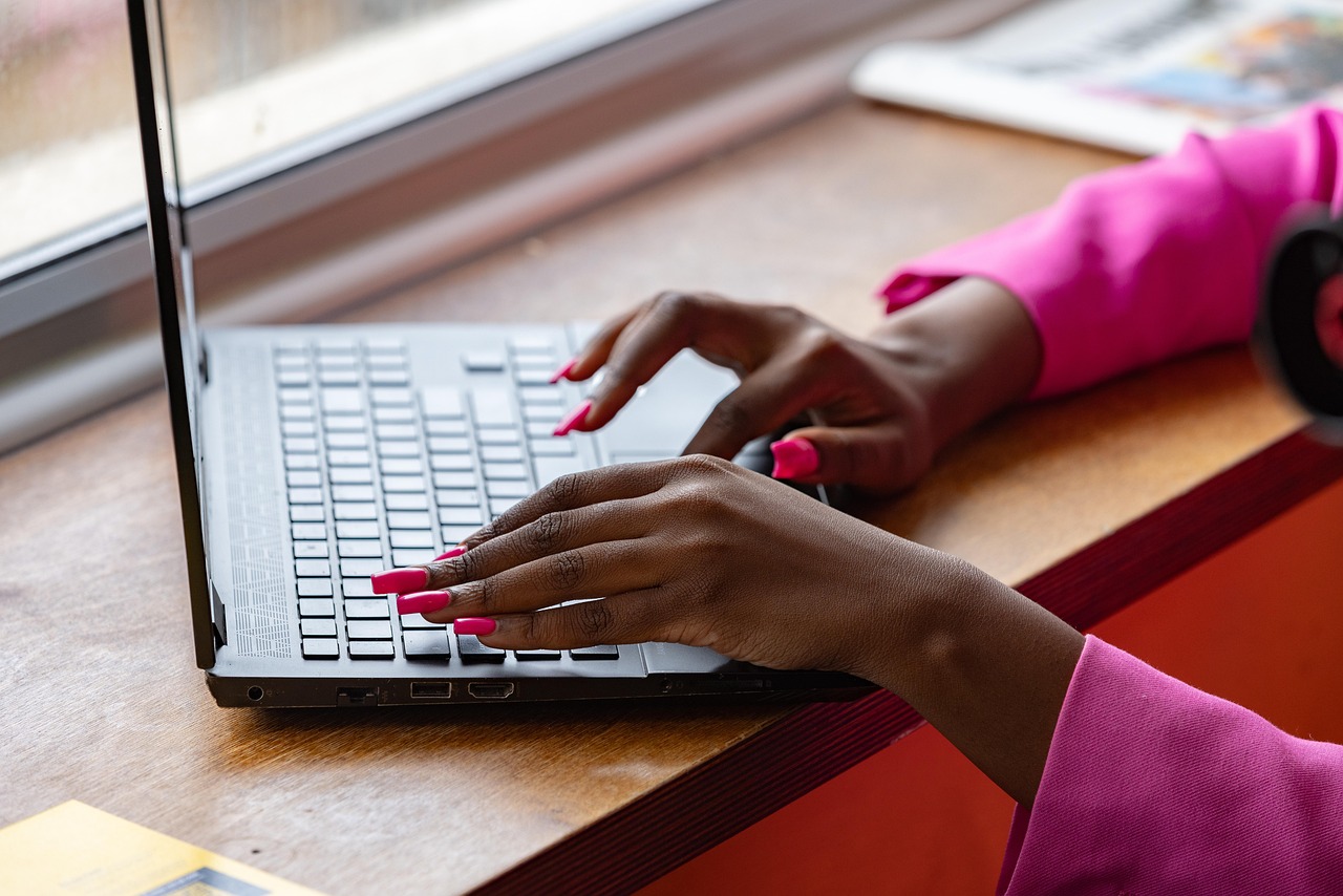 Laptop, typing, working — Web Design Agency London Supporting Brand Expansion Online